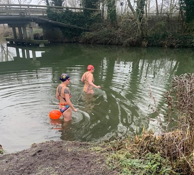 Michelle and Nicki wading into the River Chelmar for a training swim