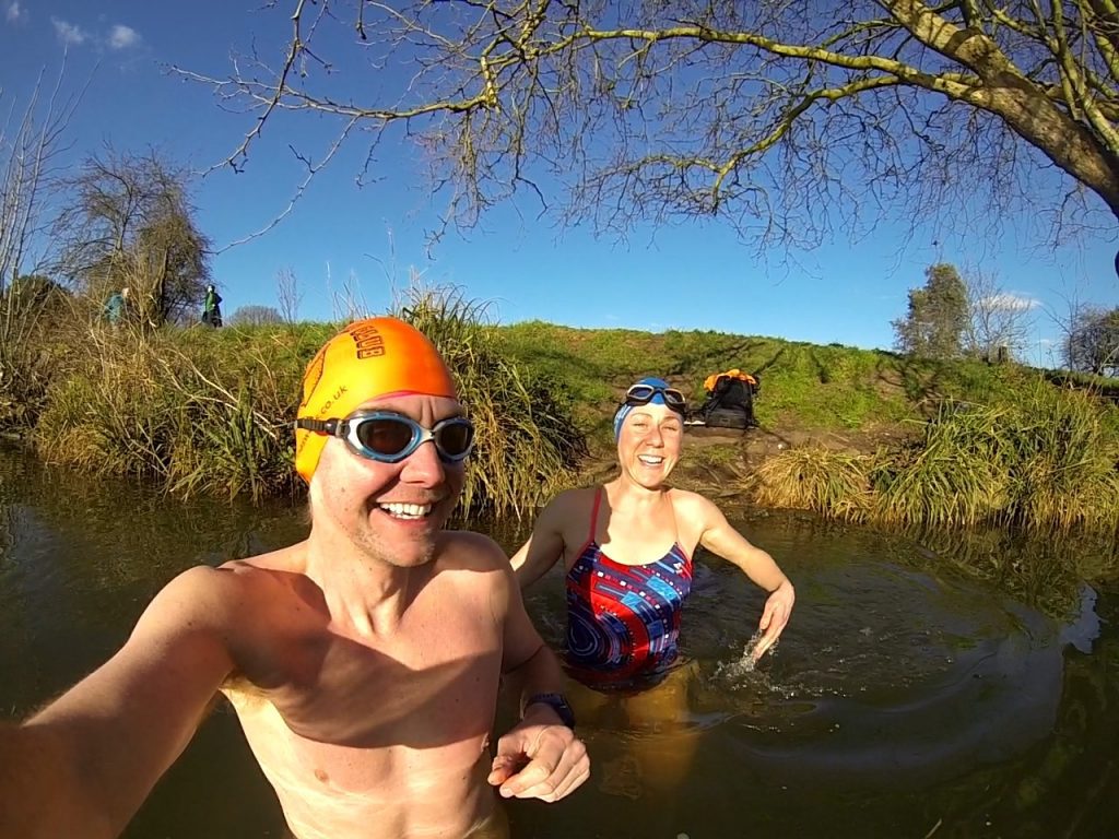Jonathan Cowie selfie standing in a river.