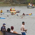 Swimmers surrounded by safety boats in the Nelson Mandela aQuelle Mile swim