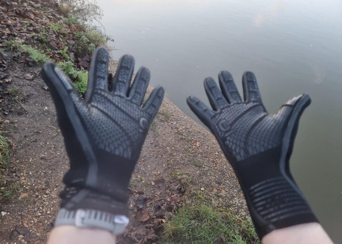 Two hands with neoprene gloves on