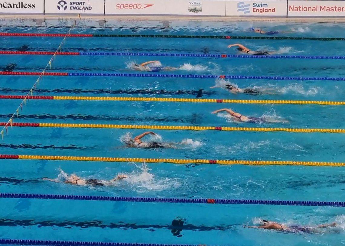 Swimmers racing in a pool