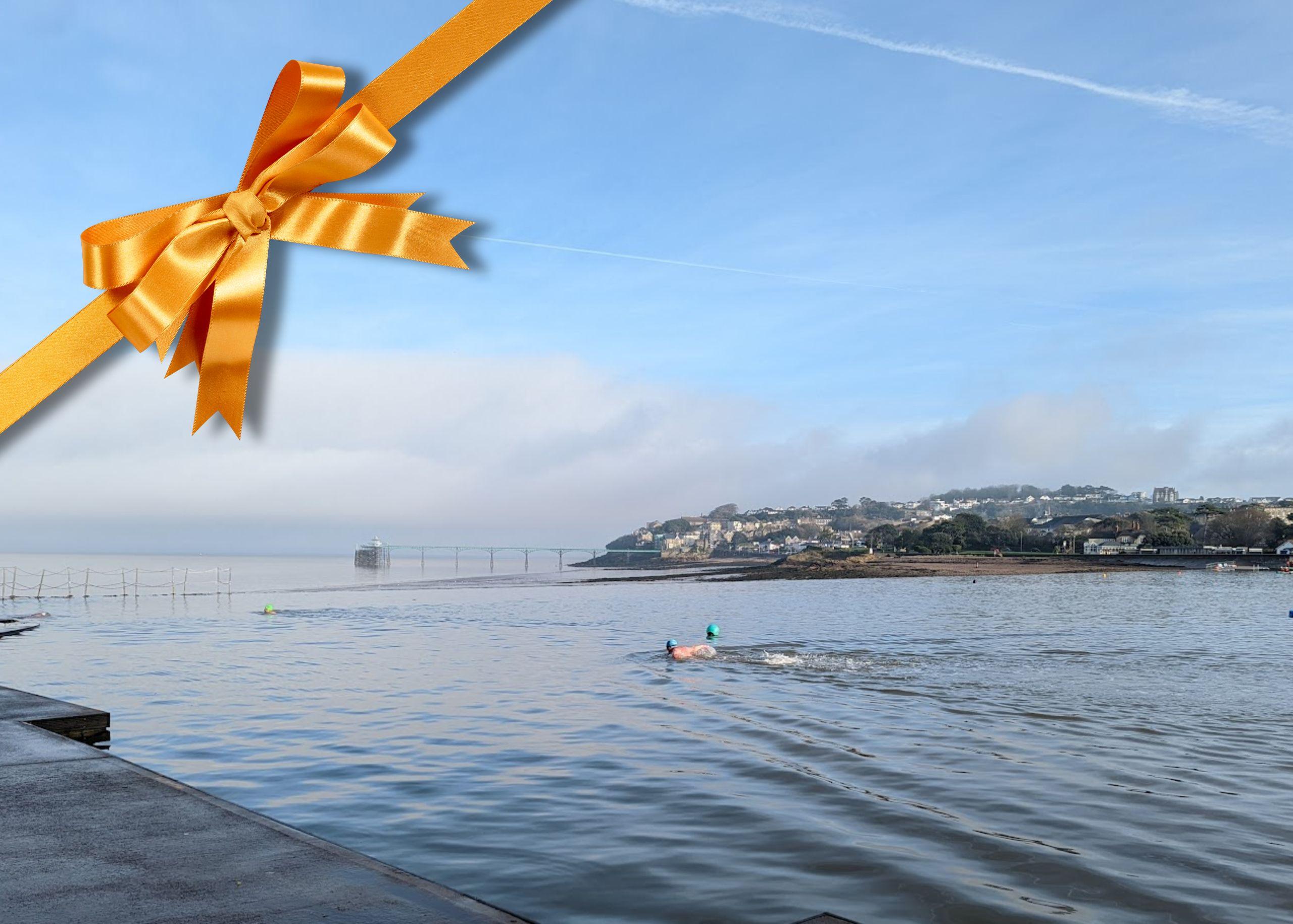 Gift experiences swimming in a lake tied with a bow